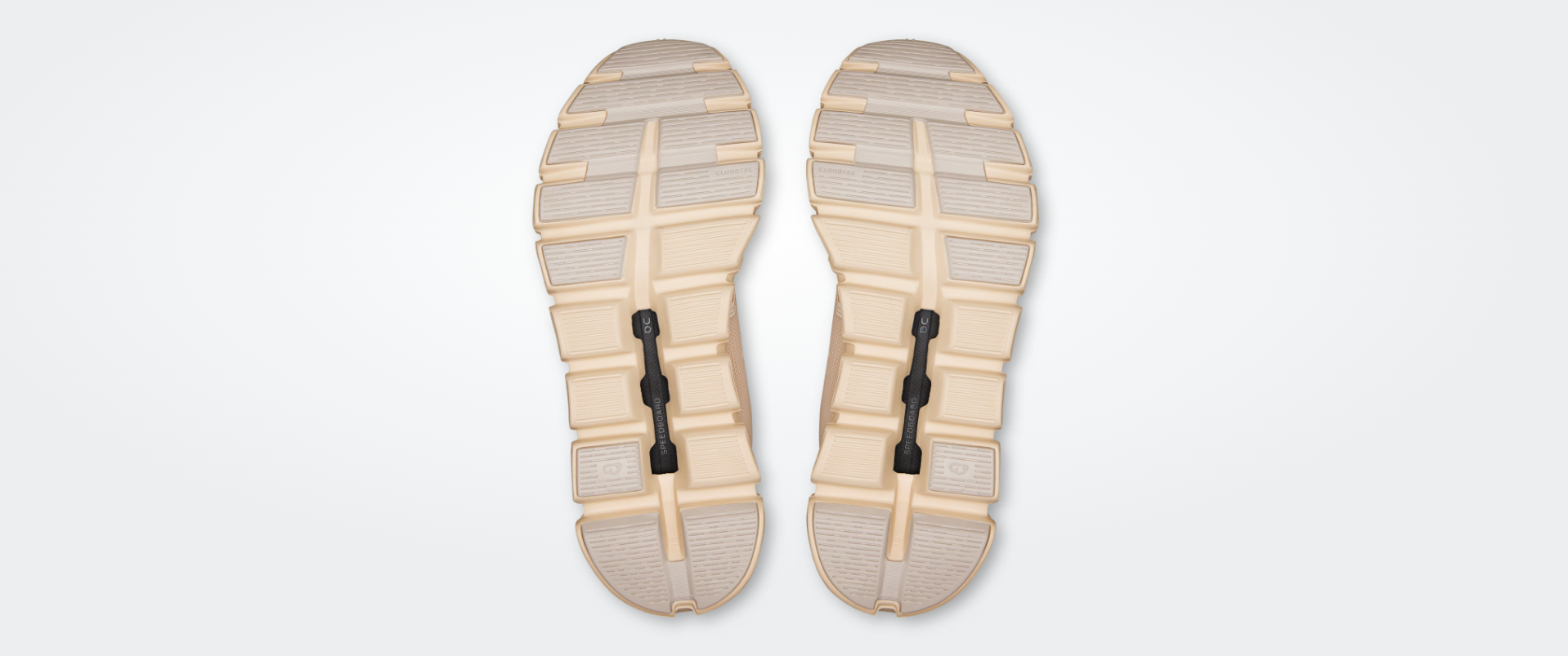 Solas de ténis desportivas bege e cinza com detalhes pretos