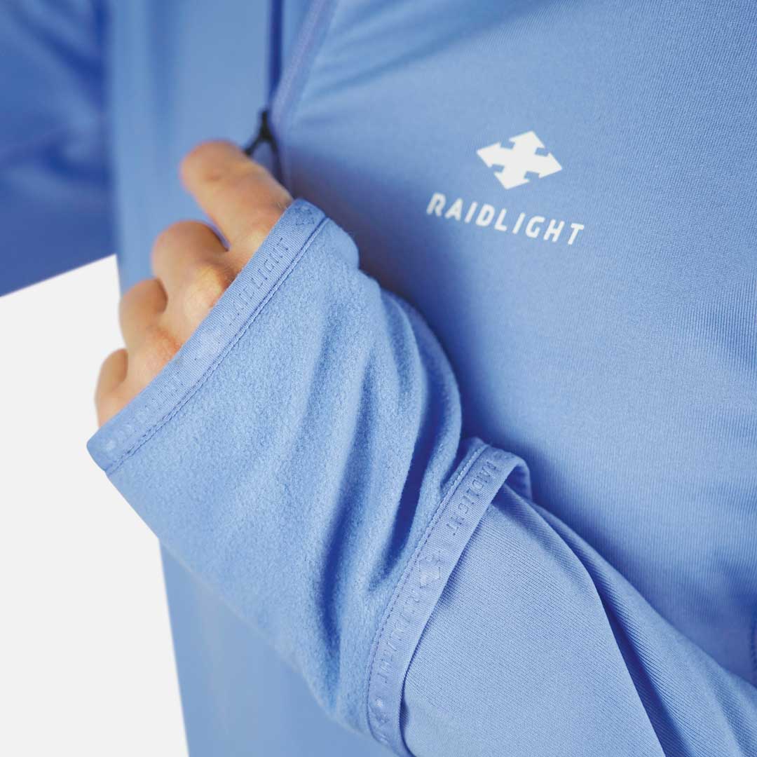 Camisa azul claro RAIDLIGHT com punho para o polegar e logótipo branco