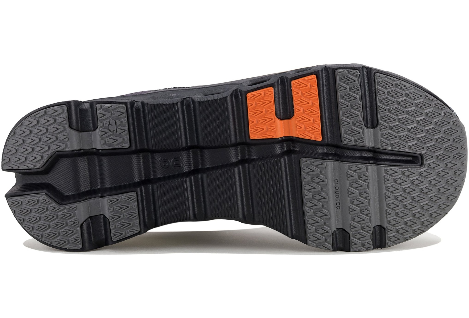 Sola de sapato desportivo preta com detalhes laranja e padrão antiderrapante