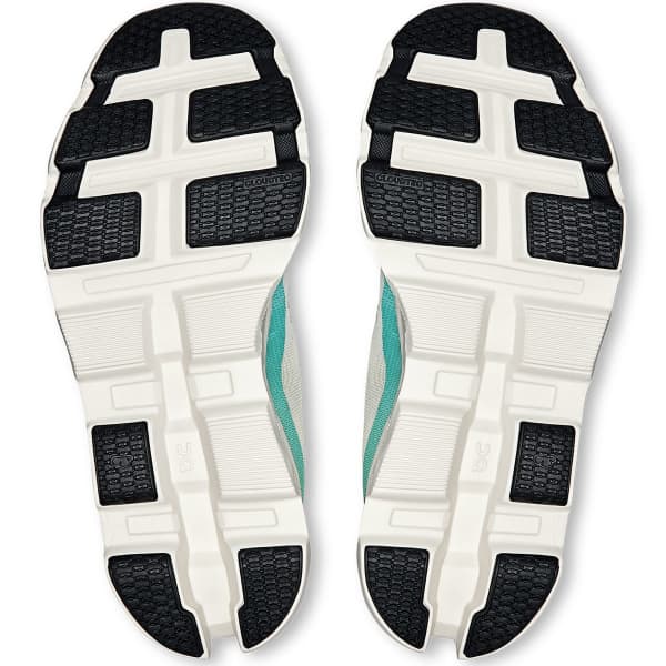 Solas de sapatilhas desportivas com padrões e cores preto, branco e azul-turquesa