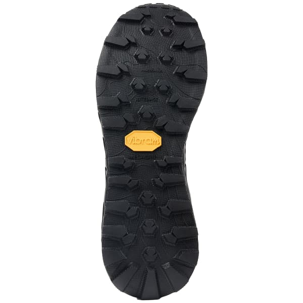 Sola preta de sapato com textura antiderrapante e logo Vibram amarelo