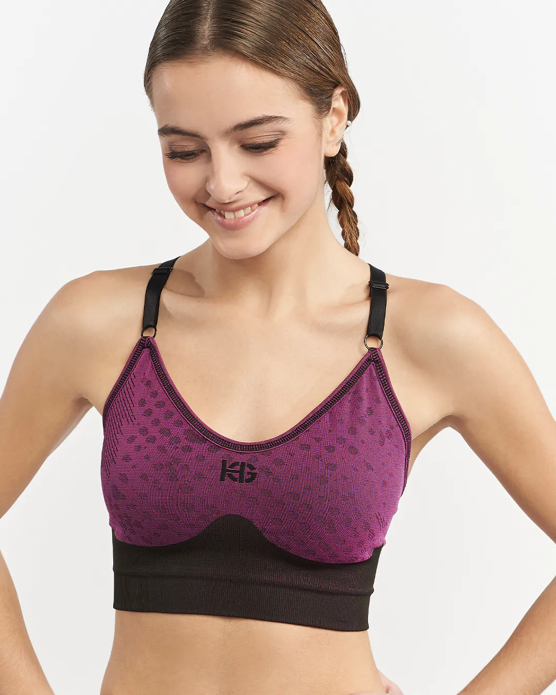 Top desportivo rosa escuro com padrão de manchas pretas e tiras pretas ajustáveis