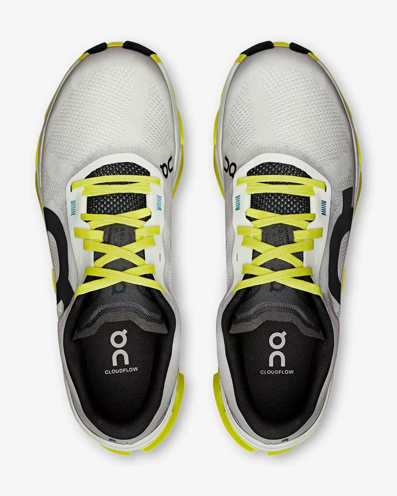 Sapatilhas desportivas brancas com detalhes em preto e amarelo fluorescente vistas de cima