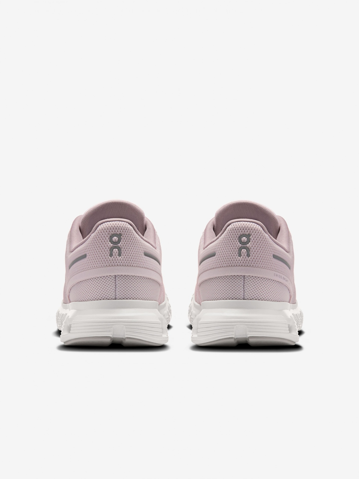 Ténis cor-de-rosa em malha com sola branca, vista traseira