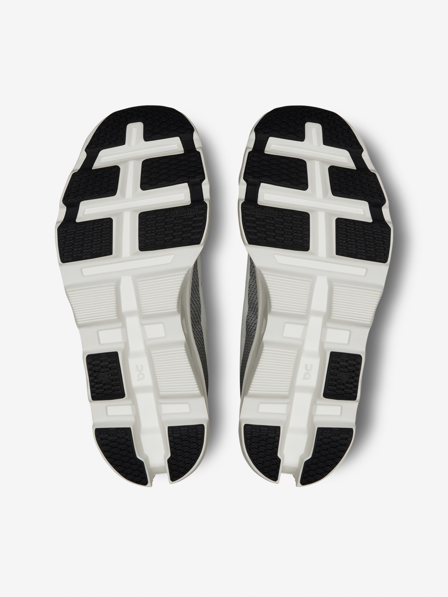 Sola de sapatos desportivos em branco e preto com padrão texturizado