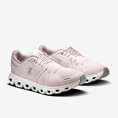 Sapatilhas desportivas rosa claro com sola branca e detalhes cinzentos