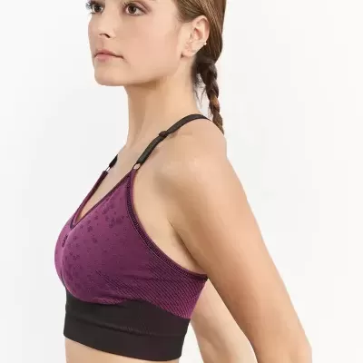 Top desportivo roxo com alças pretas vista de perfil