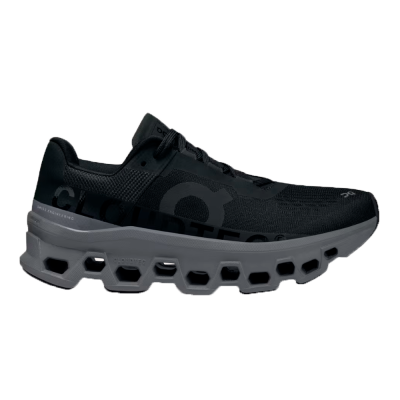 Ténis desportivos pretos com sola cinzenta e design ventilado