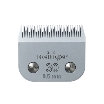 Peça metálica de máquina de cortar cabelo com texto Heininger 30 0.5 mm e dois parafusos