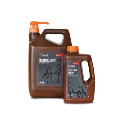 Frascos castanhos com tampa laranja de FERATONE SYRUP para cavalos