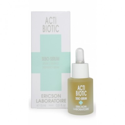 Frasco de sérum com conta-gotas e caixa de embalagem ao lado