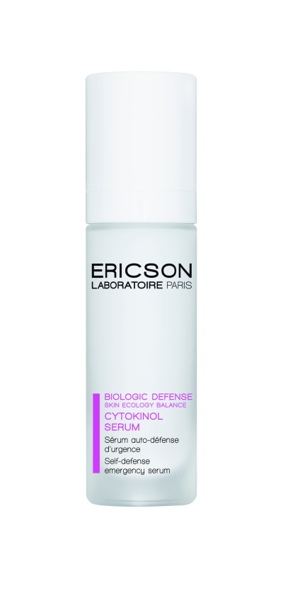Frasco branco de sérum Ericson Laboratoire Paris com tampa branca e texto roxo e preto