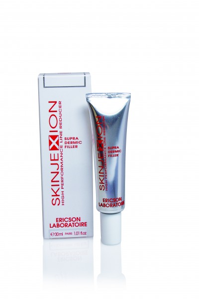 Tubo prateado e caixa branca do produto SKINJEXION da ERICSON LABORATOIRE