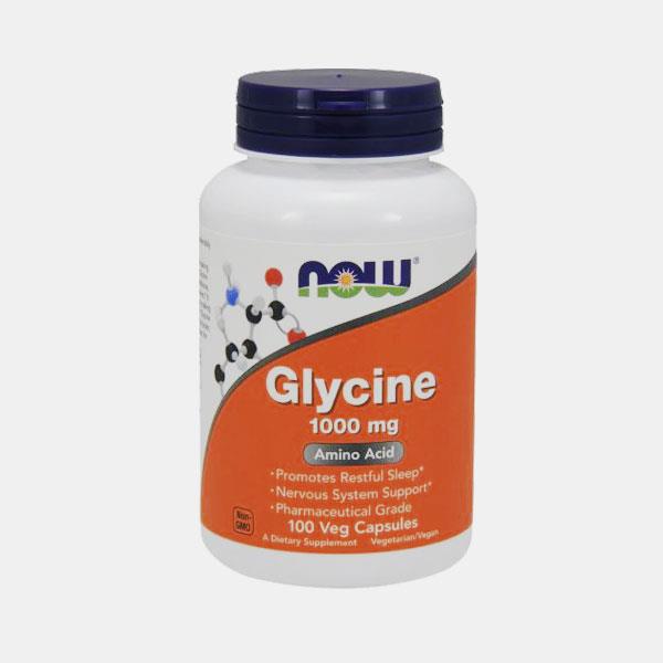 GLYCINE 1000MG 100 CAPSULAS VEGETAIS Frasco branco de suplemento Glycine 1000 mg da NOW com rótulo laranja.
