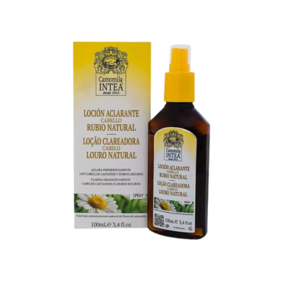 Spray clareador para cabelo loiro natural Camomila Intea em frasco escuro com tampa amarela ao lado da caixa amarela e branca