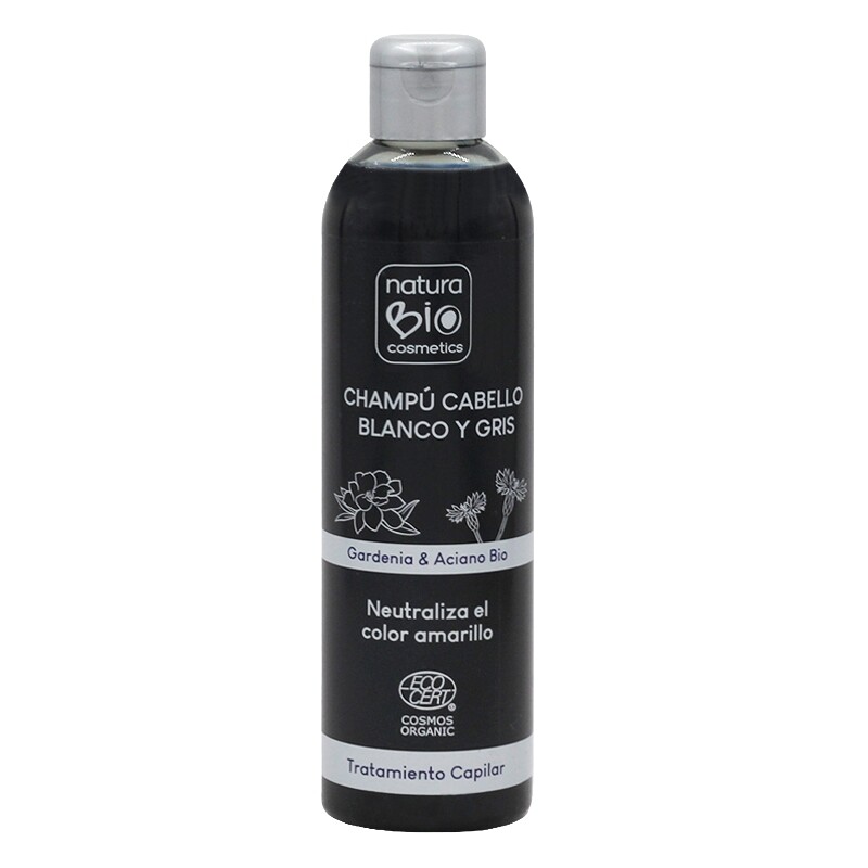 CHAMPÔ TRATAMENTO CABELOS BRANCOS CENTÁUREA BIO & GARDÉNIA 250ML - NATURABIO Frasco preto de champô Natura Bio para cabelo branco e grisalho