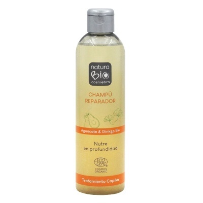 Frasco de champô Natura Bio com rótulo amarelo e tampa prateada.