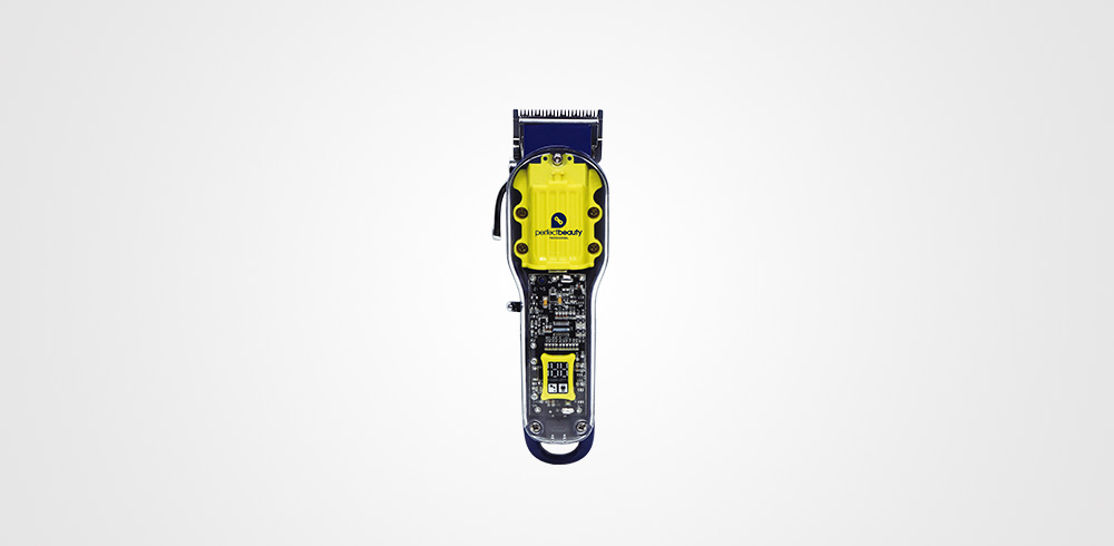 Barbeador elétrico preto e amarelo com componentes visíveis