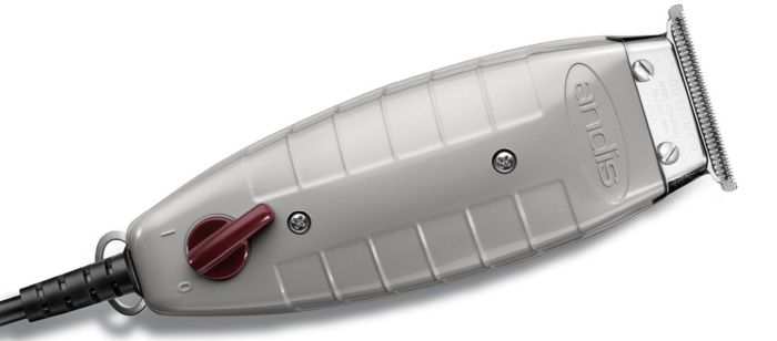 Aparelho de cortar cabelo elétrico cinza com seletor vermelho e lâmina metálica.