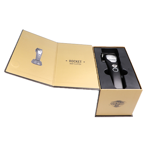Aparelho cortador de cabelo preto na caixa aberta creme com texto ROCKET HAIR CLIPPER