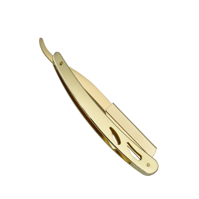 Navalha de barbear dourada em fundo branco