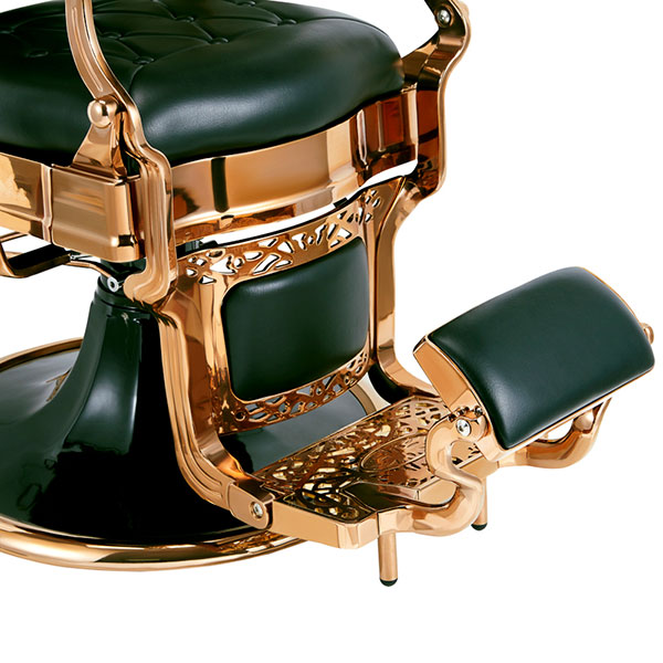 Cadeira de cabeleireiro dourada com estofos verdes e apoio para pés