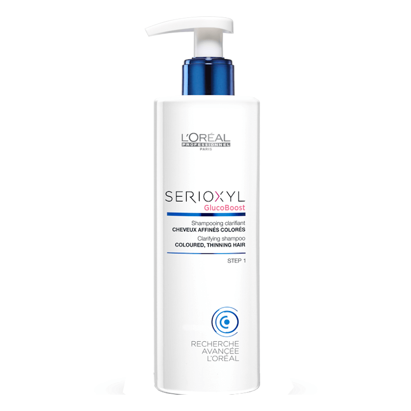 Frasco branco de shampoo L'Oréal SERIOXYL com tampa de bomba azul