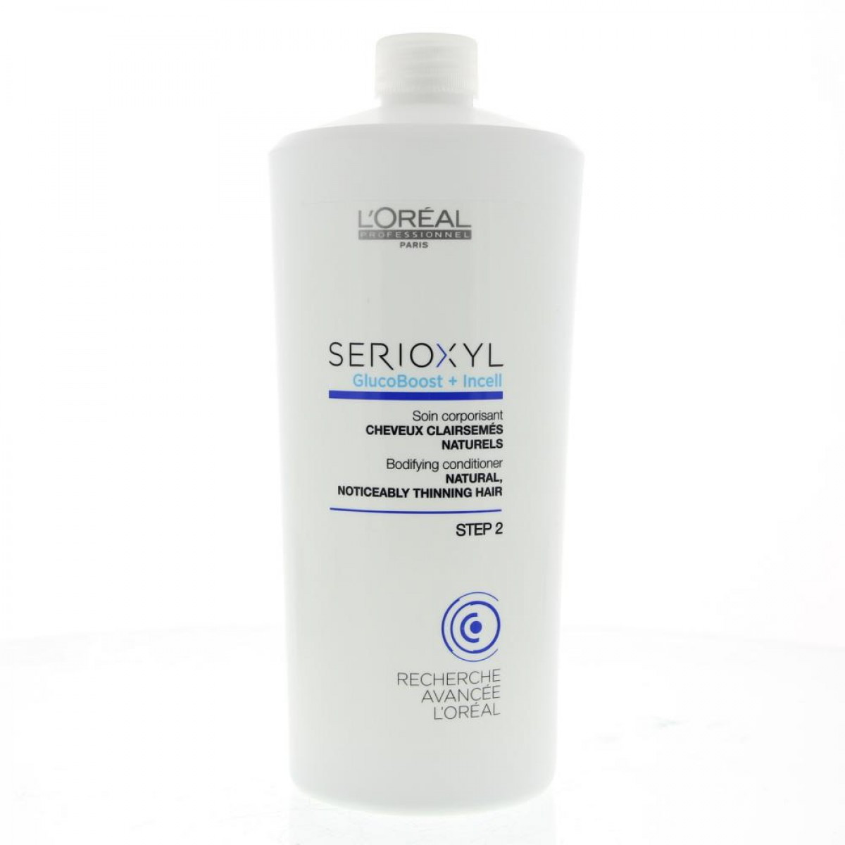 Frasco branco de condicionador L'Oréal SERIOXYL com tampa de rosca