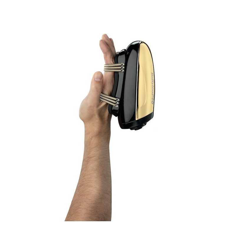 Aparelho elétrico portátil preto e dourado com molas metálicas