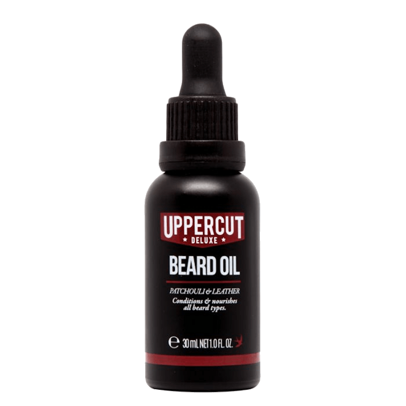 Garrafa preta de óleo para barba Uppercut Deluxe Beard Oil com tampa de conta-gotas e texto branco e vermelho