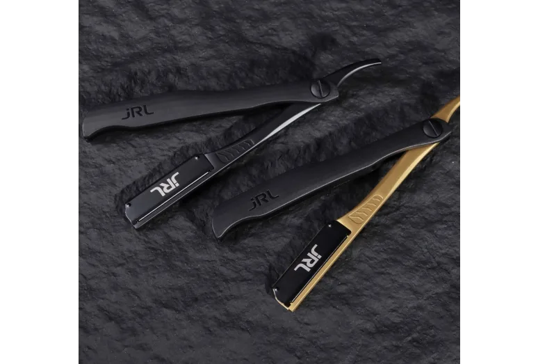 Navalhas para barbear JRL em preto e dourado sobre fundo preto