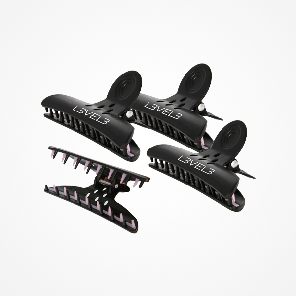 quatro ganchos de cabelo pretos com interior rosa