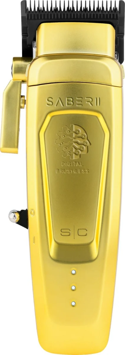 Máquina de cortar cabelo dourada com lâminas pretas e texto gravado