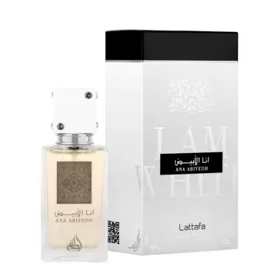 Frasco de perfume transparente com tampa branca ao lado da embalagem branca e preta