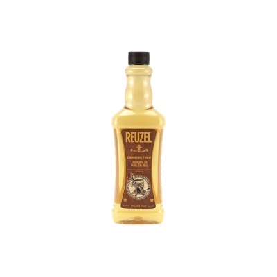 Garrafa amarela de produto Reuzel Grooming Tonic com etiqueta castanha escura e tampa preta