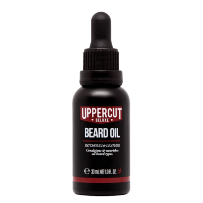 Garrafa preta de óleo para barba Uppercut Deluxe Beard Oil com tampa de conta-gotas e texto branco e vermelho