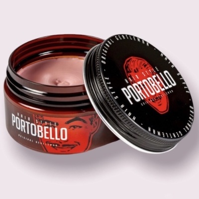 Pomada capilar PORTOBELLO em embalagem redonda com tampa preta e creme cor rosa claro