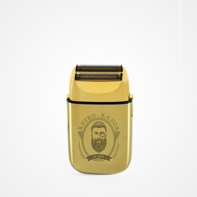 Máquina de barbear dourada com design vintage e rosto barbudo gravado