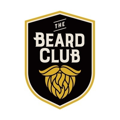 Logótipo negro e dourado com texto 'THE BEARD CLUB' e ícone de barba estilizada