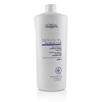 Frasco branco de condicionador L'Oréal SERIOXYL para cabelo fino colorido