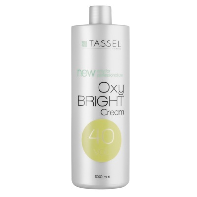 Frasco branco com texto 'TASSEL Oxy BRIGHT Cream 40 vol'