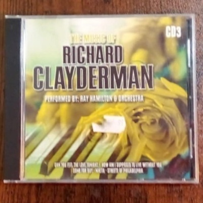 Capa de CD de Richard Clayderman com imagem de piano e flor amarela
