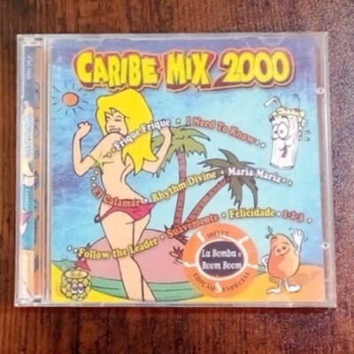 Capa frontal de CD CARIBE MIX 2000 com ilustração colorida e textos