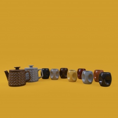 Chaleiras e canecas de cerâmica com padrões geométricos em fundo amarelo