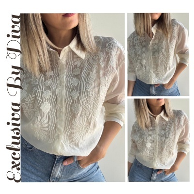 Camisa branca feminina com renda floral e mangas enroladas combinada com jeans