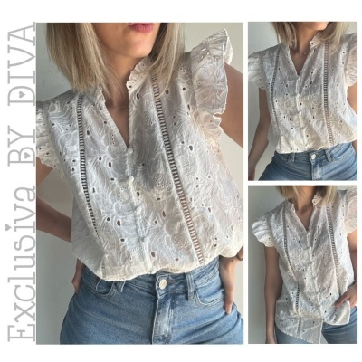 Blusa branca bordada com mangas curtas e detalhes em renda usada com jeans