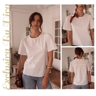 Blusa branca em tecido perfurado com padrão quadrado e manga curta