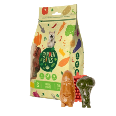 Pacote amarelo de snacks para cães GARDEN BITES com brinquedos de dentes em forma de legumes.