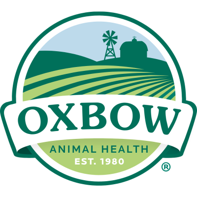 Logótipo circular com paisagem agrícola e texto OXBOW ANIMAL HEALTH EST. 1980