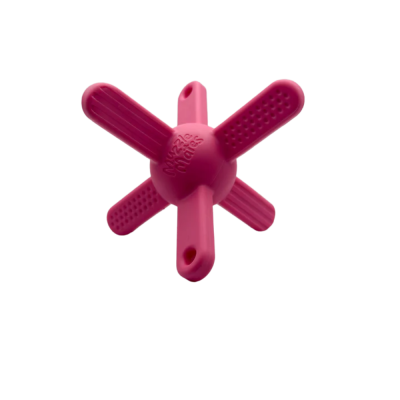 Brinquedo para cães rosa em forma de estrela com textura e texto Muzzle mates no centro.